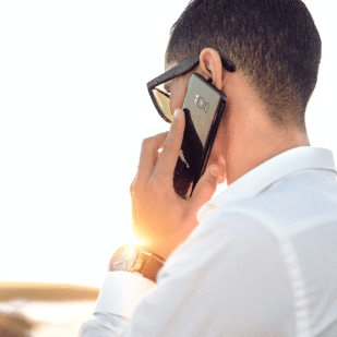 Man holding smartphone during a phone call